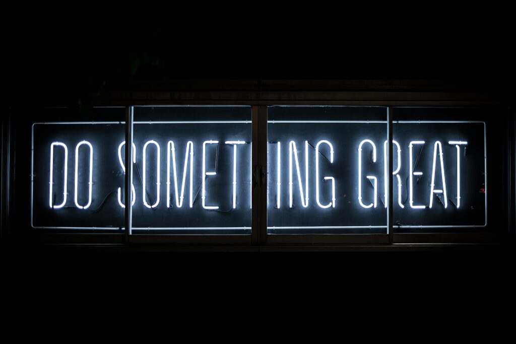 A picture of Neon Lights Saying "Do Something Great"