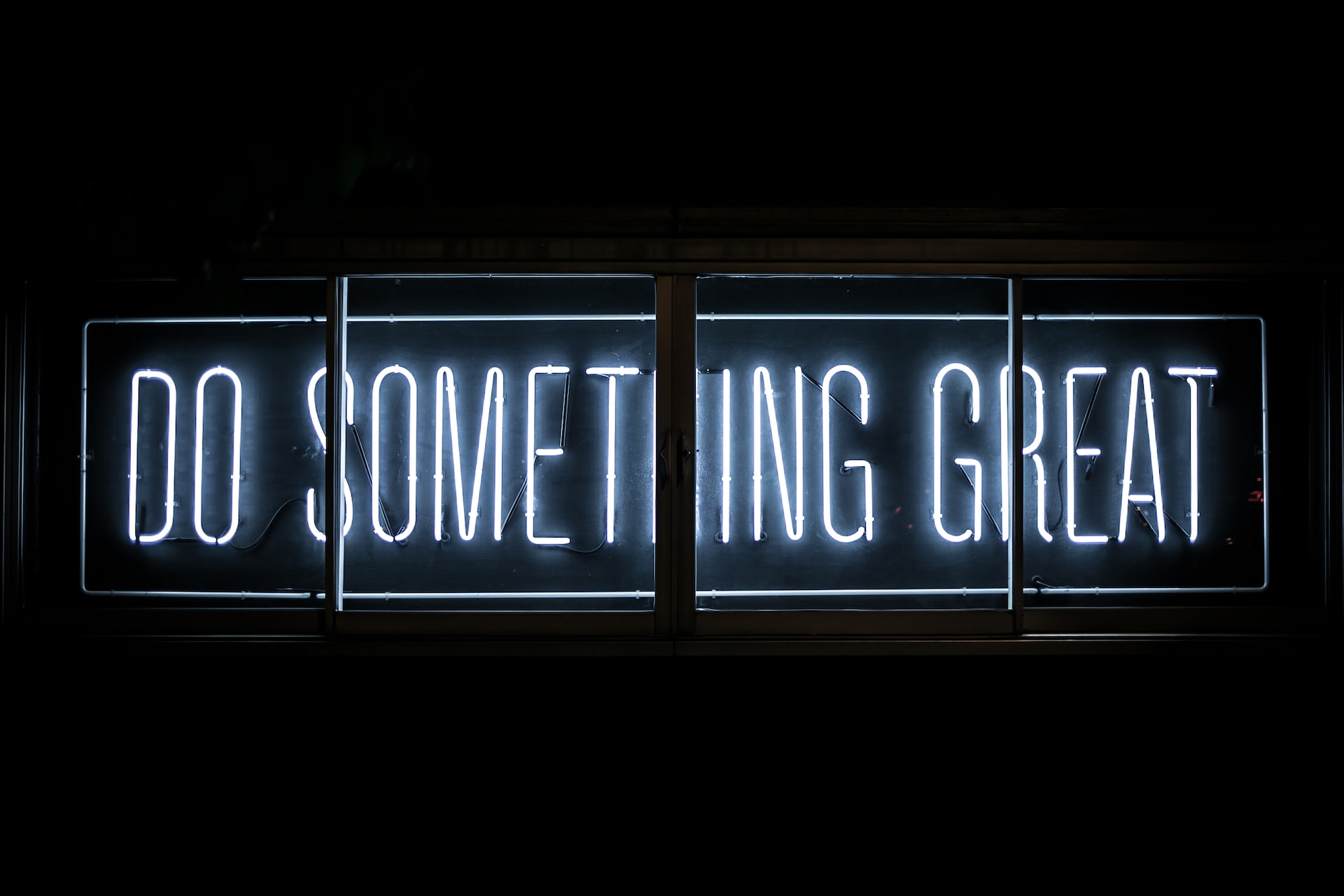 Neon sign saying "Do Something Great"